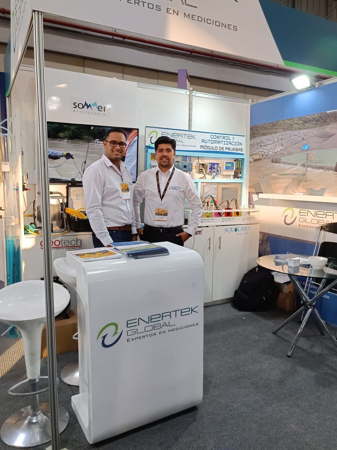 EnerTek team at a mining conference stand